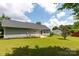 The house's back exterior reveals a well-manicured yard and tidy landscaping at 112 Brookshire Dr, Fort Mill, SC 29715