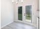 Bright dining area featuring modern chandelier and glass doors to the backyard at 112 Brookshire Dr, Fort Mill, SC 29715