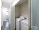 Convenient laundry room featuring a washer and dryer along with overhead shelving at 112 Brookshire Dr, Fort Mill, SC 29715