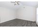 Bright living room featuring vaulted ceilings, modern flooring, and a ceiling fan at 112 Brookshire Dr, Fort Mill, SC 29715