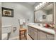 Bathroom features a large mirror, vanity with storage, and tiled floors at 115 Pine Grove Cir, Clover, SC 29710