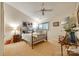 Comfortable bedroom featuring an iron bed frame, ceiling fan, and a calming color scheme for a relaxing retreat at 115 Pine Grove Cir, Clover, SC 29710