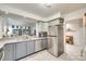 Bright kitchen with stainless steel refrigerator and view into the living room at 115 Pine Grove Cir, Clover, SC 29710