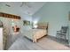 Spacious main bedroom with ample natural light, ceiling fan, and access to sunroom at 115 Pine Grove Cir, Clover, SC 29710