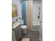 Clean bathroom features gray vanity, white tile shower-tub, and modern fixtures at 1150 Shue Rd, China Grove, NC 28023