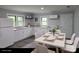 Functional kitchen area with white cabinets, modern appliances, and an adjacent dining space at 1150 Shue Rd, China Grove, NC 28023