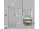 Elegant bathroom featuring glass enclosed shower with dual shower heads and natural light at 1200 Rutledge Ave, Charlotte, NC 28211