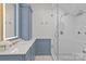 Elegant bathroom showcases marble counters, custom cabinets, and luxurious glass shower at 1200 Rutledge Ave, Charlotte, NC 28211