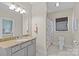 Bathroom features single sink, granite counter, and shower with decorative curtain at 1200 Rutledge Ave, Charlotte, NC 28211