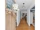 Bright entryway with hardwood floors, paneled walls, and a view through the home to living spaces at 1200 Rutledge Ave, Charlotte, NC 28211