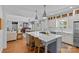Open kitchen design with an island, stainless steel appliances, and seamless flow to living and dining areas at 1200 Rutledge Ave, Charlotte, NC 28211