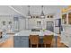 Modern kitchen with stainless steel appliances, a large island, and seamless access to the outdoor patio at 1200 Rutledge Ave, Charlotte, NC 28211