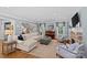Spacious living room with comfortable seating, fireplace, piano, and staircase offers an inviting atmosphere at 1200 Rutledge Ave, Charlotte, NC 28211