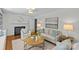 Cozy living room with a fireplace, comfortable seating, and tasteful decor creating an inviting atmosphere at 1200 Rutledge Ave, Charlotte, NC 28211