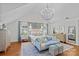 Main bedroom featuring hardwood floors, sitting area, and a decorative chandelier at 1200 Rutledge Ave, Charlotte, NC 28211