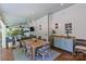 Inviting outdoor dining area with seating, dining table, wet bar, and white shiplap at 1200 Rutledge Ave, Charlotte, NC 28211