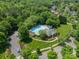 Aerial view of community pool and clubhouse surrounded by lush greenery and well-manicured lawns at 12039 Lawings Corner Dr, Huntersville, NC 28078