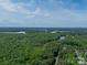 Expansive aerial view of the lake showing the neighborhood’s serene and wooded setting at 12039 Lawings Corner Dr, Huntersville, NC 28078