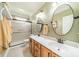 A bathroom with double sinks, vanity, a large mirror and tile floors at 12039 Lawings Corner Dr, Huntersville, NC 28078