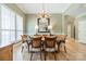 Cozy dining room enhanced by hardwood floors, with a stylish chandelier illuminating the space at 12039 Lawings Corner Dr, Huntersville, NC 28078