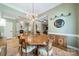 Elegant dining room with chandelier lighting, hardwood floors, and great for entertaining at 12039 Lawings Corner Dr, Huntersville, NC 28078