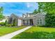 Charming brick home with dormers and a manicured front lawn, offering great curb appeal at 12039 Lawings Corner Dr, Huntersville, NC 28078