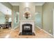 Beautiful fireplace with marble hearth and decorative mantle, creating a focal point in the open living space at 12039 Lawings Corner Dr, Huntersville, NC 28078