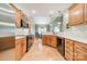 Beautiful kitchen features wooden cabinets, black appliances, tile backsplash, and opens to the dining room at 12039 Lawings Corner Dr, Huntersville, NC 28078