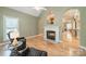 Inviting living area features a fireplace, hardwood floors and elegant architectural details at 12039 Lawings Corner Dr, Huntersville, NC 28078