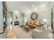 Inviting living room boasts a fireplace, comfortable seating, hardwood floors, and a neutral color palette at 12039 Lawings Corner Dr, Huntersville, NC 28078