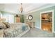 A beautifully decorated main bedroom featuring neutral paint, modern lighting, carpet, and wood furnishings at 12039 Lawings Corner Dr, Huntersville, NC 28078