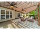 Inviting outdoor patio with a pergola, ceiling fans, and comfortable seating at 12039 Lawings Corner Dr, Huntersville, NC 28078