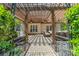 Inviting outdoor patio with a pergola, ceiling fans, and comfortable seating at 12039 Lawings Corner Dr, Huntersville, NC 28078