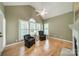 Cozy sitting room with hardwood floors, vaulted ceilings, and ample light creating an inviting space to relax at 12039 Lawings Corner Dr, Huntersville, NC 28078