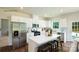 Bright kitchen featuring white cabinets, stainless appliances, and a kitchen island with bar stool seating at 136 Parker Claire Ln, Kings Mountain, NC 28086