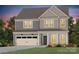 Charming two-story home with a craftsman-style exterior and an attached two-car garage at 15020 Meadows Hunt Ln # 159, Huntersville, NC 28078