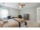 Bedroom features chair seating, neutral carpet, and plenty of natural light at 16337 Greybriar Forest Ln, Charlotte, NC 28278