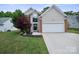 Charming single-Gathering home featuring a well-manicured lawn and an attached two-car garage at 16337 Greybriar Forest Ln, Charlotte, NC 28278