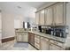 Bright kitchen featuring granite counters, mosaic backsplash and stainless steel dishwasher at 16337 Greybriar Forest Ln, Charlotte, NC 28278