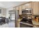 Modern kitchen with stainless steel appliances and granite countertops at 16337 Greybriar Forest Ln, Charlotte, NC 28278