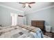 Comfortable bedroom featuring hardwood floors, ceiling fan, dresser, and bed at 16337 Greybriar Forest Ln, Charlotte, NC 28278