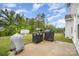 Spacious backyard patio with outdoor cooking area and lush landscaping at 18026 Stark Way, Charlotte, NC 28278