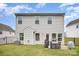 Back of house with patio, fenced yard, and outdoor cooking equipment at 18026 Stark Way, Charlotte, NC 28278