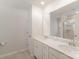 Spacious bathroom features double sinks, granite counters, tile flooring, and tiled shower at 18026 Stark Way, Charlotte, NC 28278