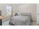 Comfortable bedroom with soft carpet, work station, and window at 18026 Stark Way, Charlotte, NC 28278