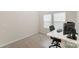 Bedroom with carpeted floor, a window for natural light, and a desk setup for work at 18026 Stark Way, Charlotte, NC 28278