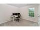 Bedroom with carpeted floor, a window for natural light, and a desk setup for work at 18026 Stark Way, Charlotte, NC 28278