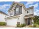 A charming two-story home boasting a two-car garage, stone accents, and meticulous landscaping at 18026 Stark Way, Charlotte, NC 28278