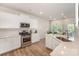 Well-lit kitchen with stainless steel appliances, white cabinetry, and a center island at 18026 Stark Way, Charlotte, NC 28278