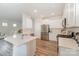 Modern kitchen with stainless steel appliances, white cabinets, and quartz countertops at 18026 Stark Way, Charlotte, NC 28278